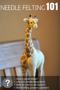 a needle felt giraffe sitting on top of a wooden bench with the caption needle felting 101