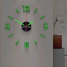 a wall clock with green numbers on it