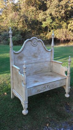 an old wooden bed sitting in the grass