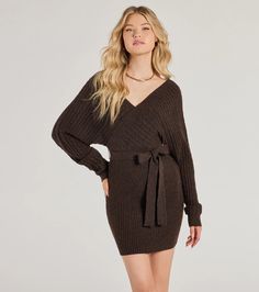 Cozy up in the cutest cable knit mini dress featuring a V-neckline, a surplice wrap front and back design, and long dolman-style sleeves. The tie-front high waist and form-hugging fit will highlight your curves, making it your fave dress of the season.Fit & FeaturesCable knit fabric with plenty of stretchV-neckline, surplice front and back designBack bar strapLong dolman sleevesTie-front waistMini-length form-hugging fitRuns true to size Cute Winter Dress, White Holiday Dress, Sequin Holiday Dress, Backless Dress Short, Red Holiday Dress, Outfits New Year, Beach Wedding Guest Dress, Nye Dress, Lace Dress Styles