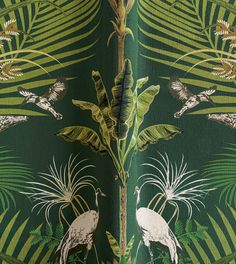 a green wallpaper with white birds and palm leaves on the bottom right hand corner