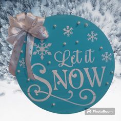 a blue sign that says let it snow