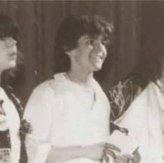 three women sitting next to each other smiling