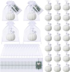 twelve white pumpkins in clear bags with ribbons and tags on the front, set of 12