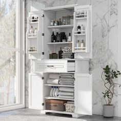 an open cabinet in the corner of a room with white walls and marble flooring