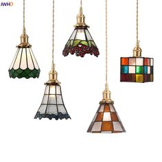 four different colored lights hanging from the ceiling