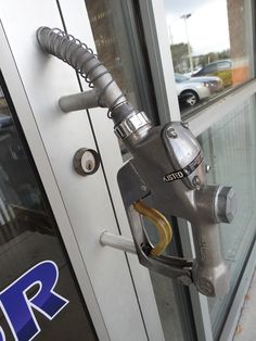 a gas pump attached to the side of a building