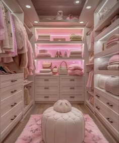 a walk in closet filled with lots of white furniture and pink carpeted flooring