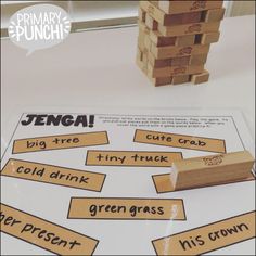 a pile of wooden blocks sitting on top of a table next to a stack of words