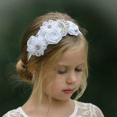 Follow and Tag us on social media ♥FB: SweetValentinaBabyBoutique ♥IG: SweetValentinaStore Exquisite handmade piece combining rhinestones and handmade delicate flowers. Our beautiful couture headbands make for the perfect accessory for all of your special occasions. They look gorgeous on young flower girls and sophisticated on brides as well. They are backed with a soft felt that matches your elastic color to keep things soft and comfortable for your little ones. This unique headband will for su White Baby Headband, Baptism Headband, Unique Headband, Flower Girl Hairstyles, Cute Headbands, White Headband, Delicate Flowers, Diy Beauty Hacks