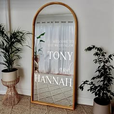 there is a mirror that says, welcome to the wedding of tony and hannah