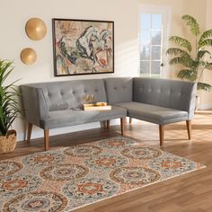 a living room with a couch and rug in front of a painting on the wall