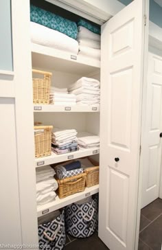 the closet is full of folded towels and other things to use as storage for linens