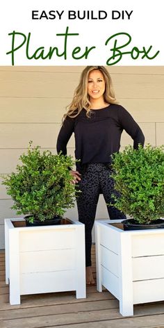 a woman standing next to two planters with the words easy build diy planter box