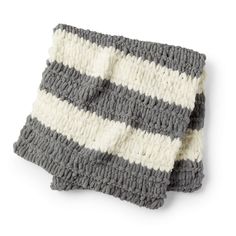 a gray and white striped dishcloth on a white background