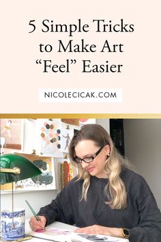 a woman sitting at a desk writing with the words 5 simple tricks to make art feel easier