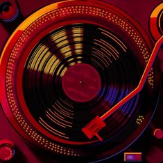 an old record player with red and blue lights on it's side, in front of a purple background