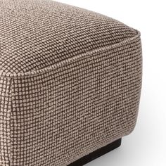 the footstool is made out of fabric