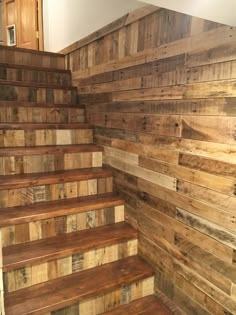 some wooden stairs are lined up against the wall