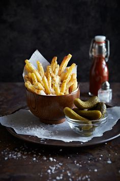 salt and potato fries with pickles in a bowl