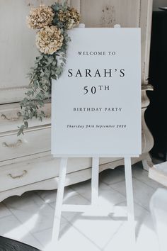 a sign that says welcome to sarah's 50th birthday party with flowers on it