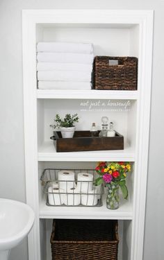 the bathroom is clean and ready to be used as a storage area for towels, toiletries