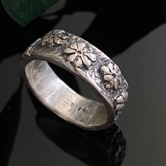 Antique or vintage sterling silver chunky floral band. Good condition with typical signs of age and wear. Shank interior has several scratches.  Ring size 7 6mm wide Weighs 5.9 grams Chunky Rings Silver, Antique Silver Rings Chunky, Chunky Silver Rings Aesthetic Grunge, Vintage Sterling Silver Flower Ring, Chunky Silver Rings Bohemian, Chunky Silver Rose Ring, Chunky Silver Rings, Chunky Rings, Vintage Sterling Silver