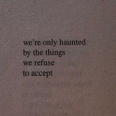 an old book with the words we're only haunted by the things we refuse to accept