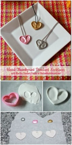 heart shaped pendants are being displayed on a white plate with pink and gold accents