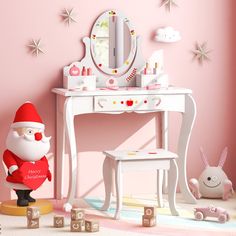 a pink room with a white desk, mirror and santa clause doll in front of it