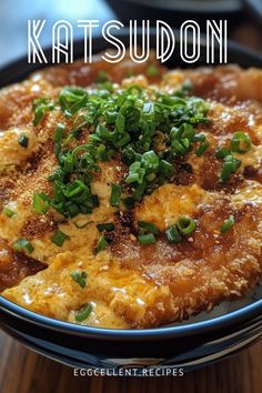 a close up of a plate of food on a table with the words katsu sudon