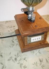 an old fashioned radio sitting on top of a bed with a flower in the middle