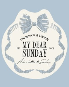 the logo for my dear sunday, with a bow on it's head and an inscription