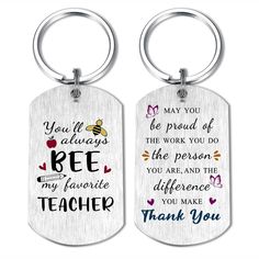 two metal key chains with the words be my teacher and thank you on them,