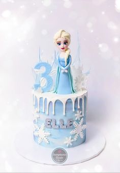 a frozen princess birthday cake with frosting and icing