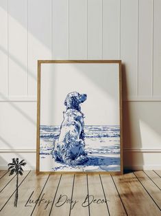 a blue and white dog sitting on top of a wooden floor next to a palm tree