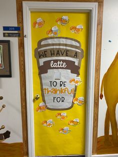 a yellow door with a sign that says we have a latte to be thanksgiving top