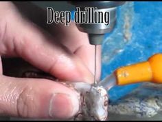 a person is drilling something with a drill