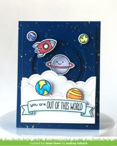 a card with an image of planets and the words you are out of this world