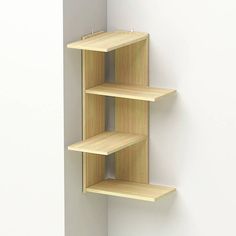 a wooden shelf mounted to the side of a wall