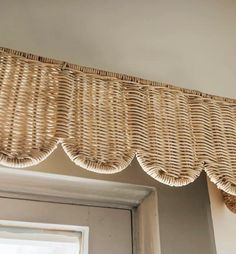 a wicker window valance hanging from the ceiling