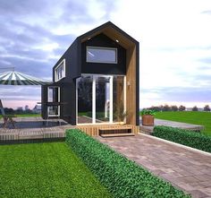 an artist's rendering of a small black house in the middle of a field