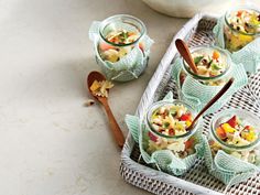 small jars filled with food sitting on top of a table