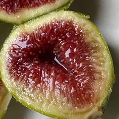 some cut up pieces of fruit sitting on top of a table