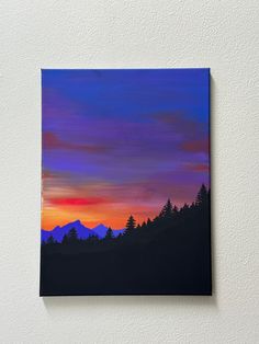 a painting of a sunset with trees and mountains in the background, on a white wall