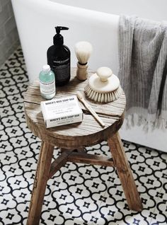 a wooden stool with various items on it