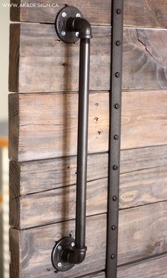 an old wooden door with two metal handles