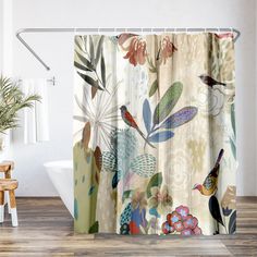 a shower curtain with birds and flowers on it in a white room next to a bathtub