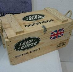 a wooden crate sitting on top of a white table