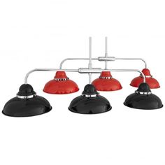 three red and black lights hanging from a ceiling fixture